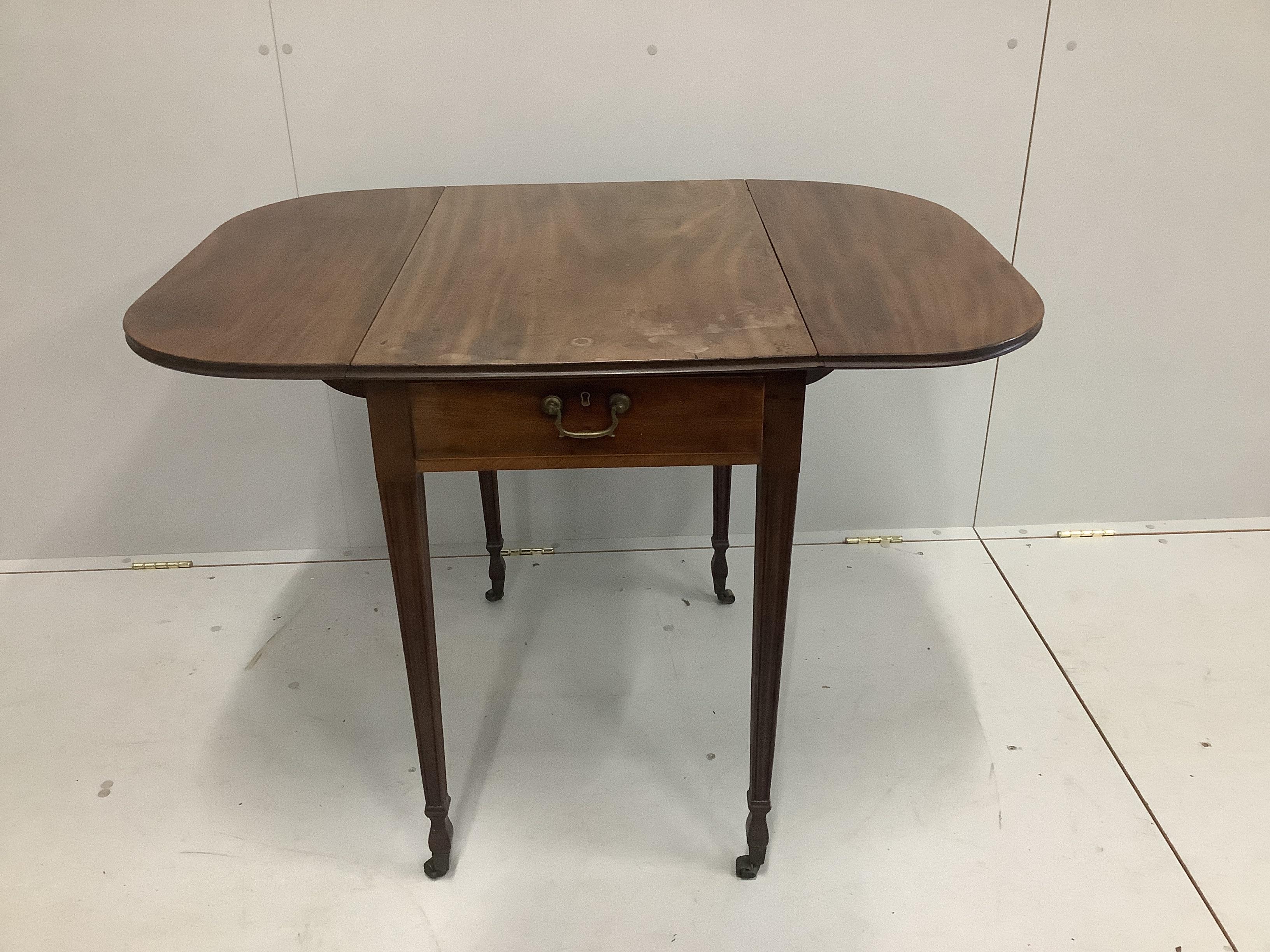 A George III mahogany Pembroke table with tapering square legs and brass castors, width 72cm, height 48cm